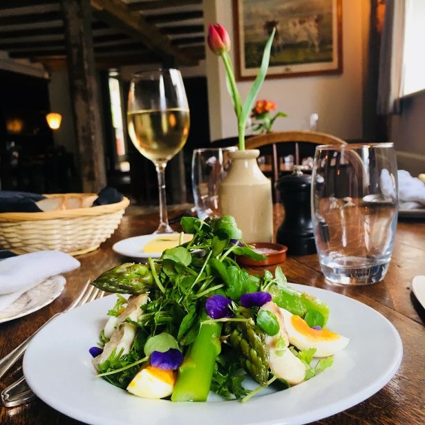 Asparagus salad with soft egg and edible flowers