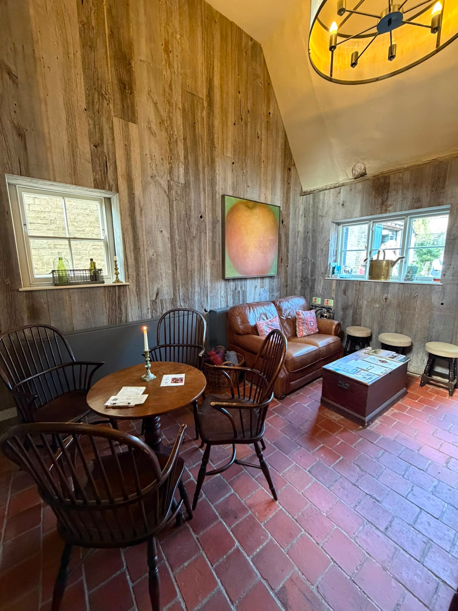 The Red Lion bar snug with leather sofa and Cambridge Pamments