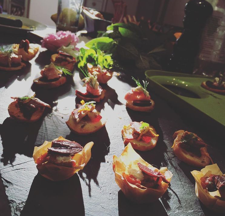 Canapés on a slate board in natural sunlight