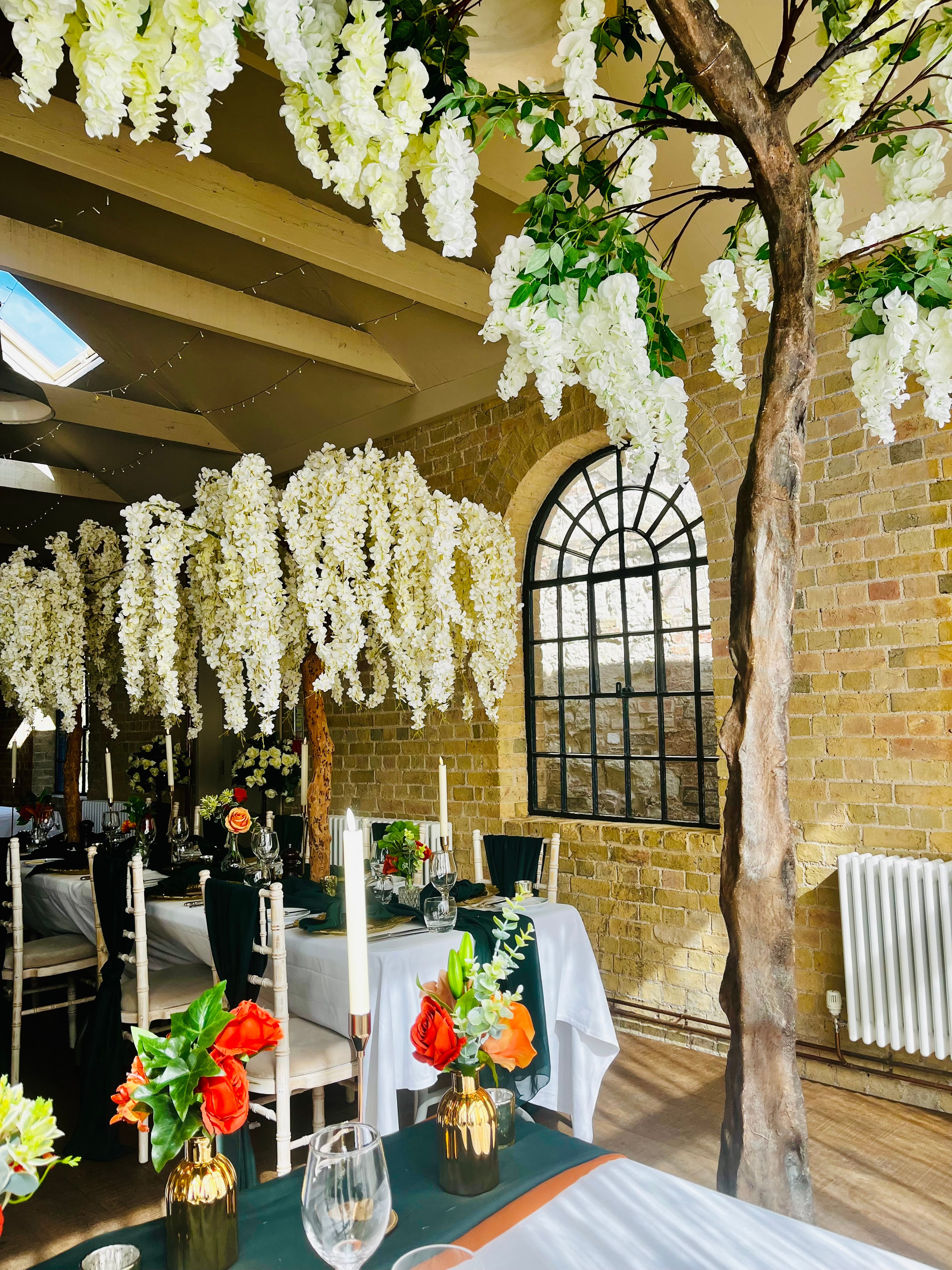 The Coach House set for a wedding with hanging wisteria