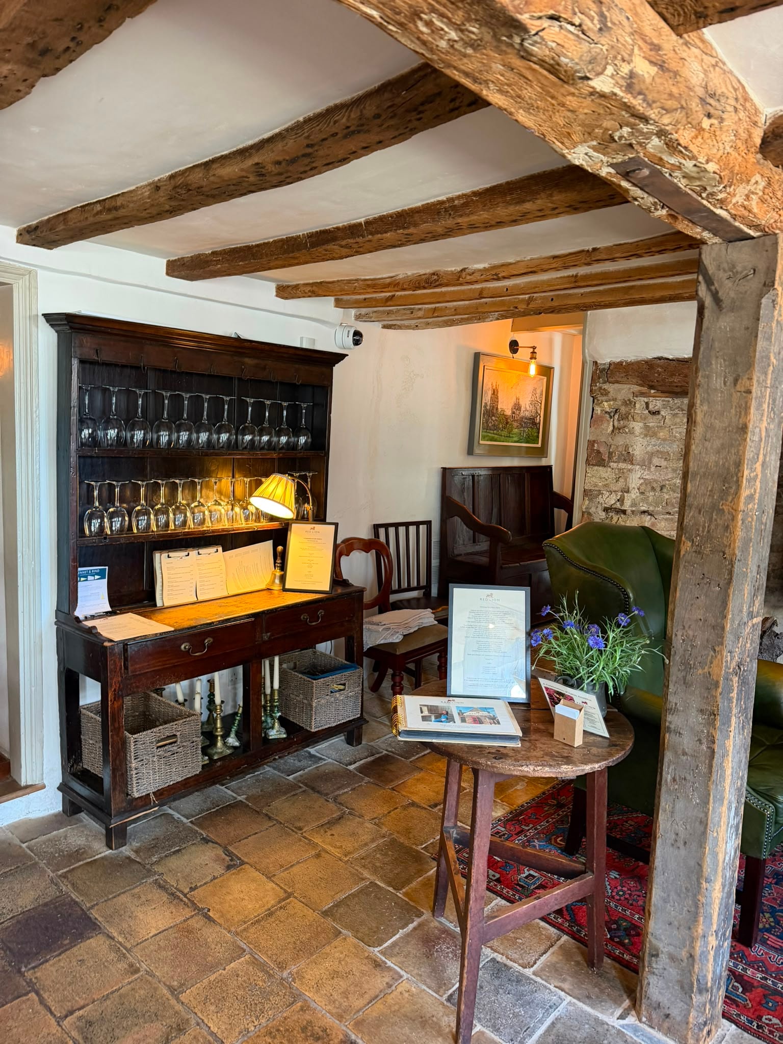 The Red Lion entrance hall with antique dresser and Cambridge Pamments
