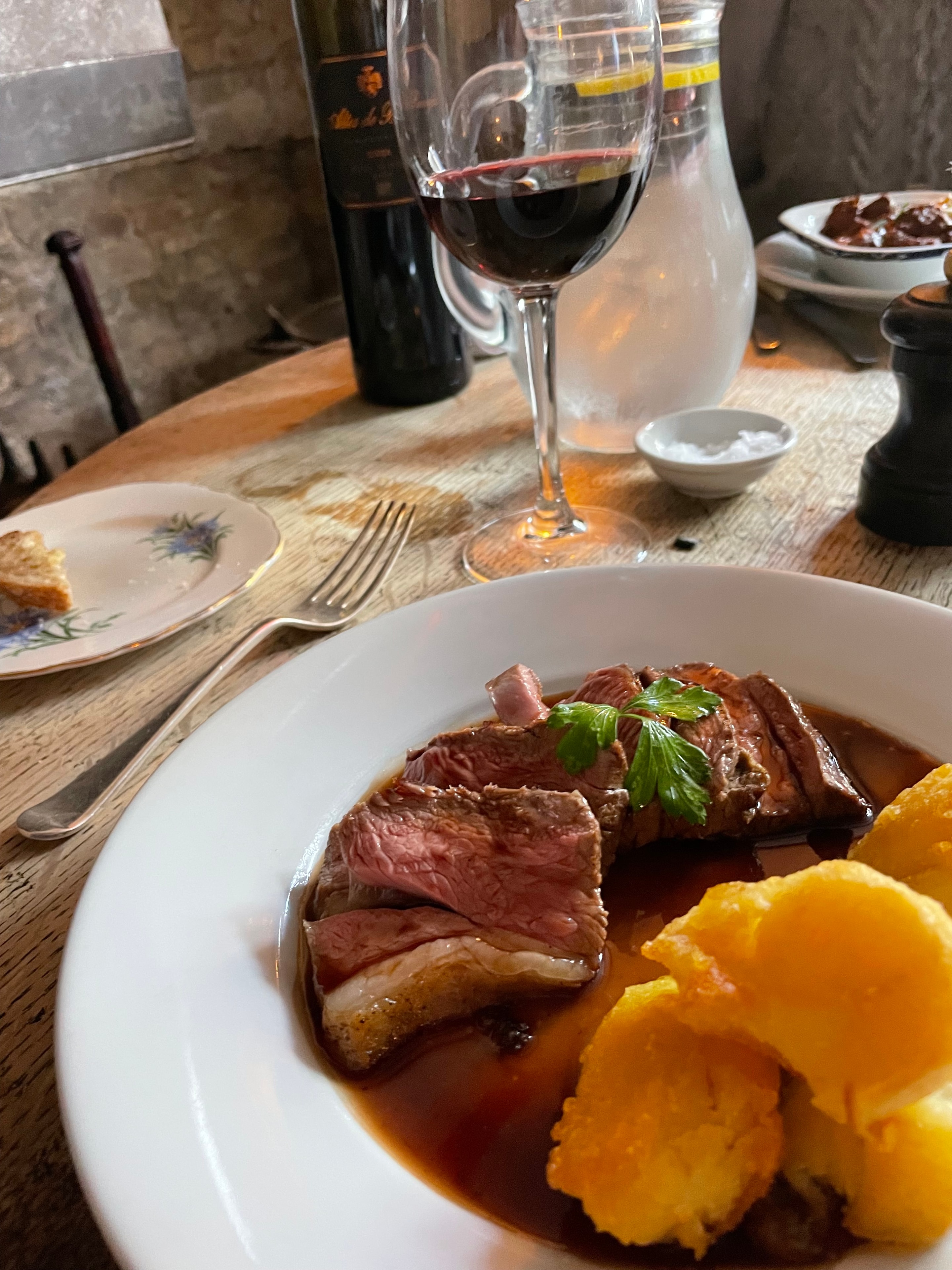 Guest photo: fine dining steak with roast potatoes and red wine at The Red Lion, Soham