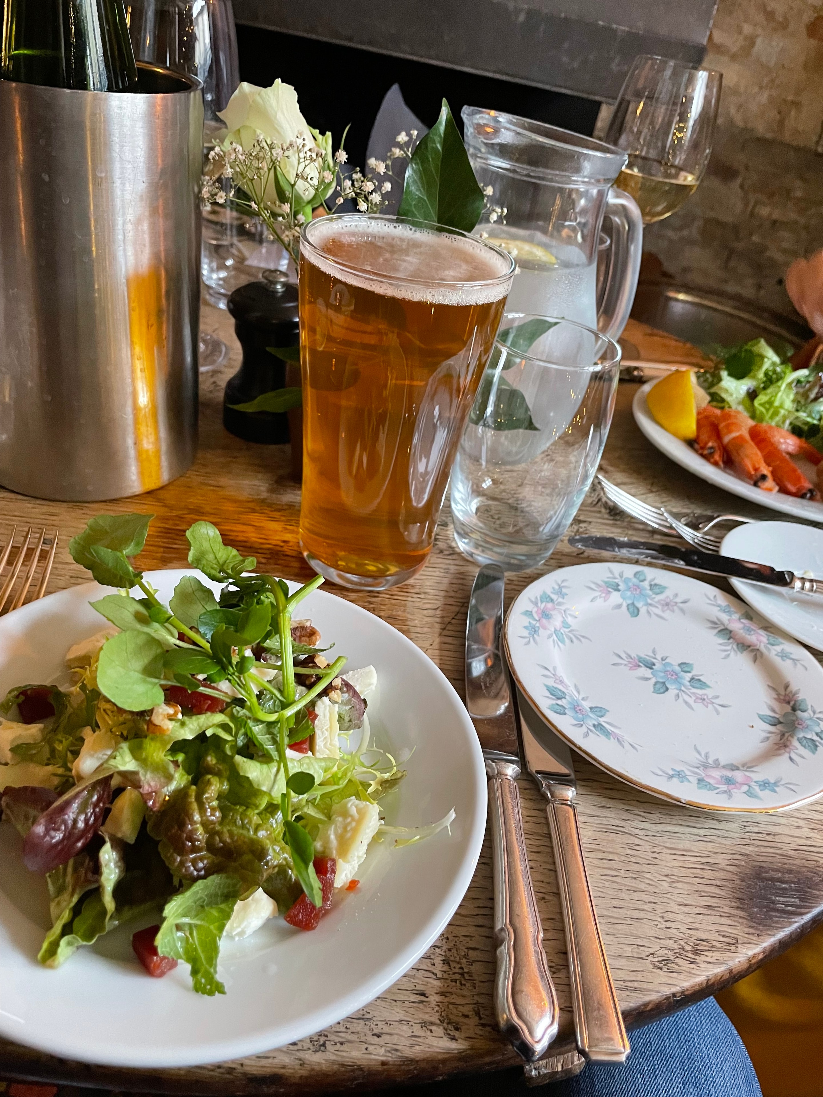 Guest photo: table setting with craft beer and dressed salad at The Red Lion, Soham