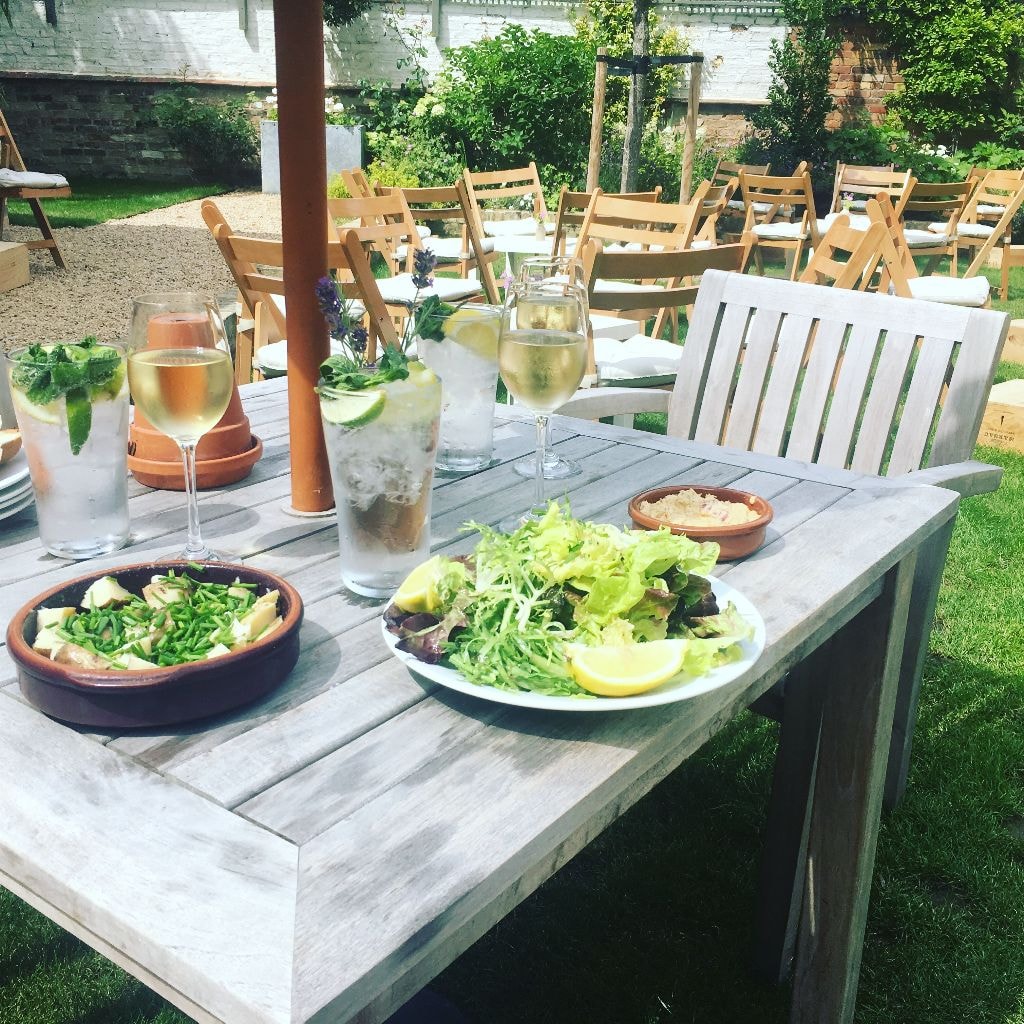 Summer lunch laid out in the walled garden