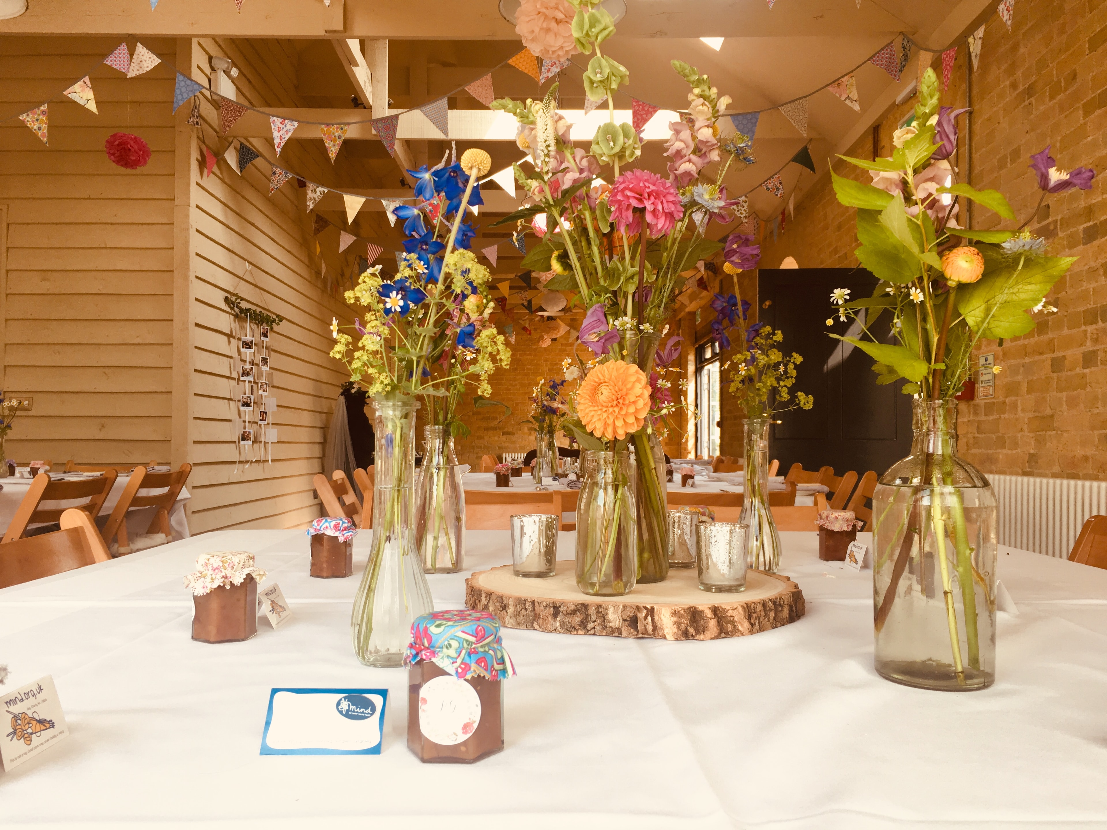 The Coach House decorated with bunting and wildflower table centrepieces