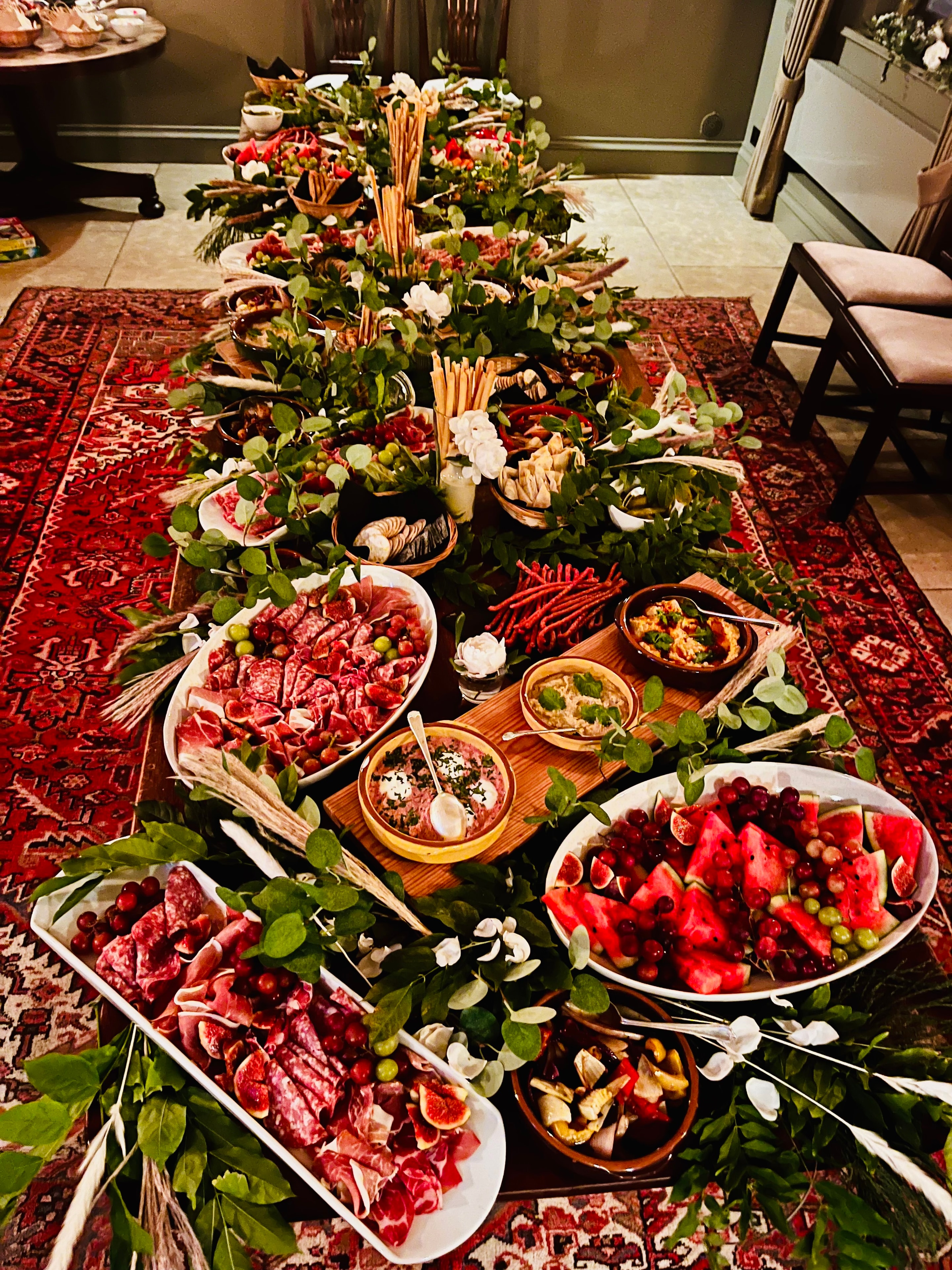 Grazing table with charcuterie, fresh fruit and flowers at The Red Lion